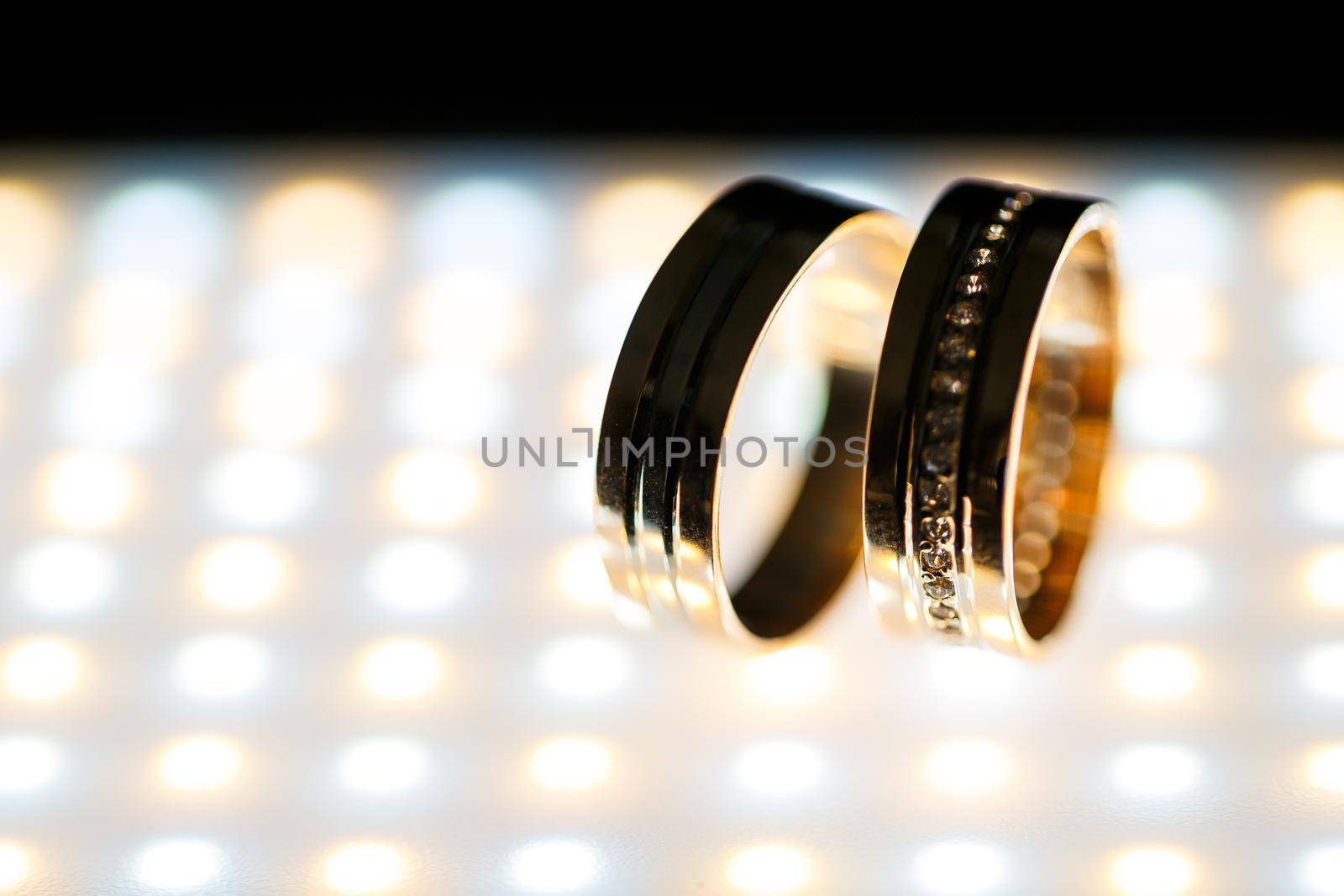 Gold wedding rings for newlyweds on wedding day by Dmitrytph