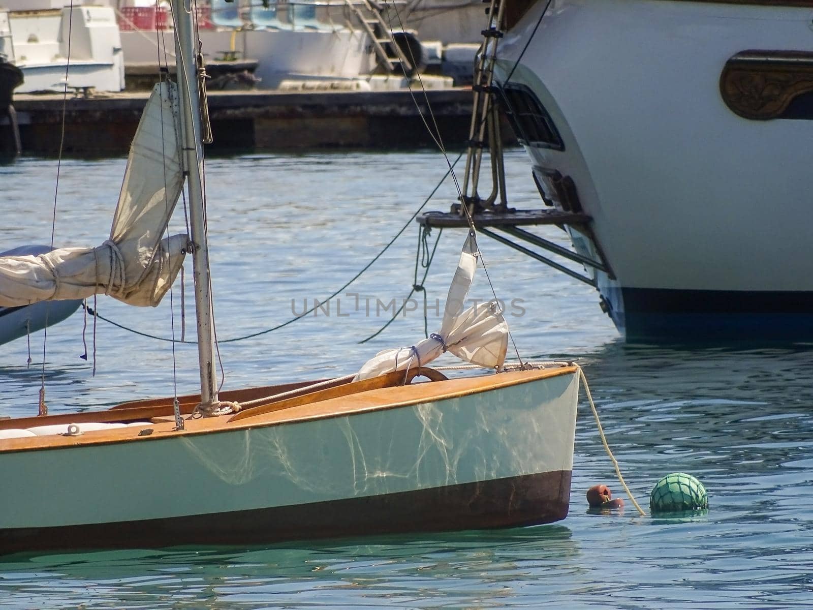 Yachts and boats in the bay on a sunny day close up