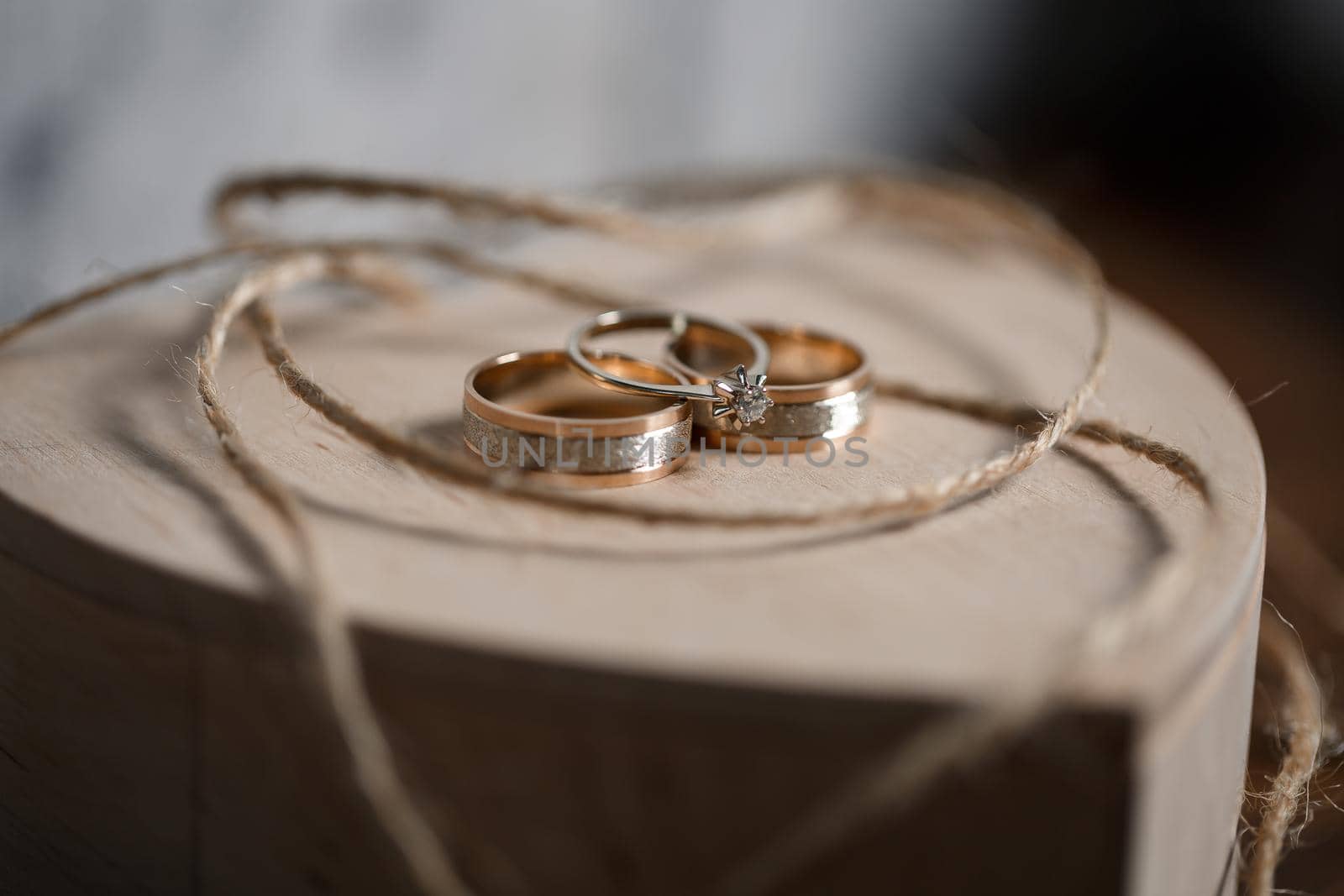 Gold wedding rings for newlyweds on their wedding day. Jewelry for the holiday of a couple in love