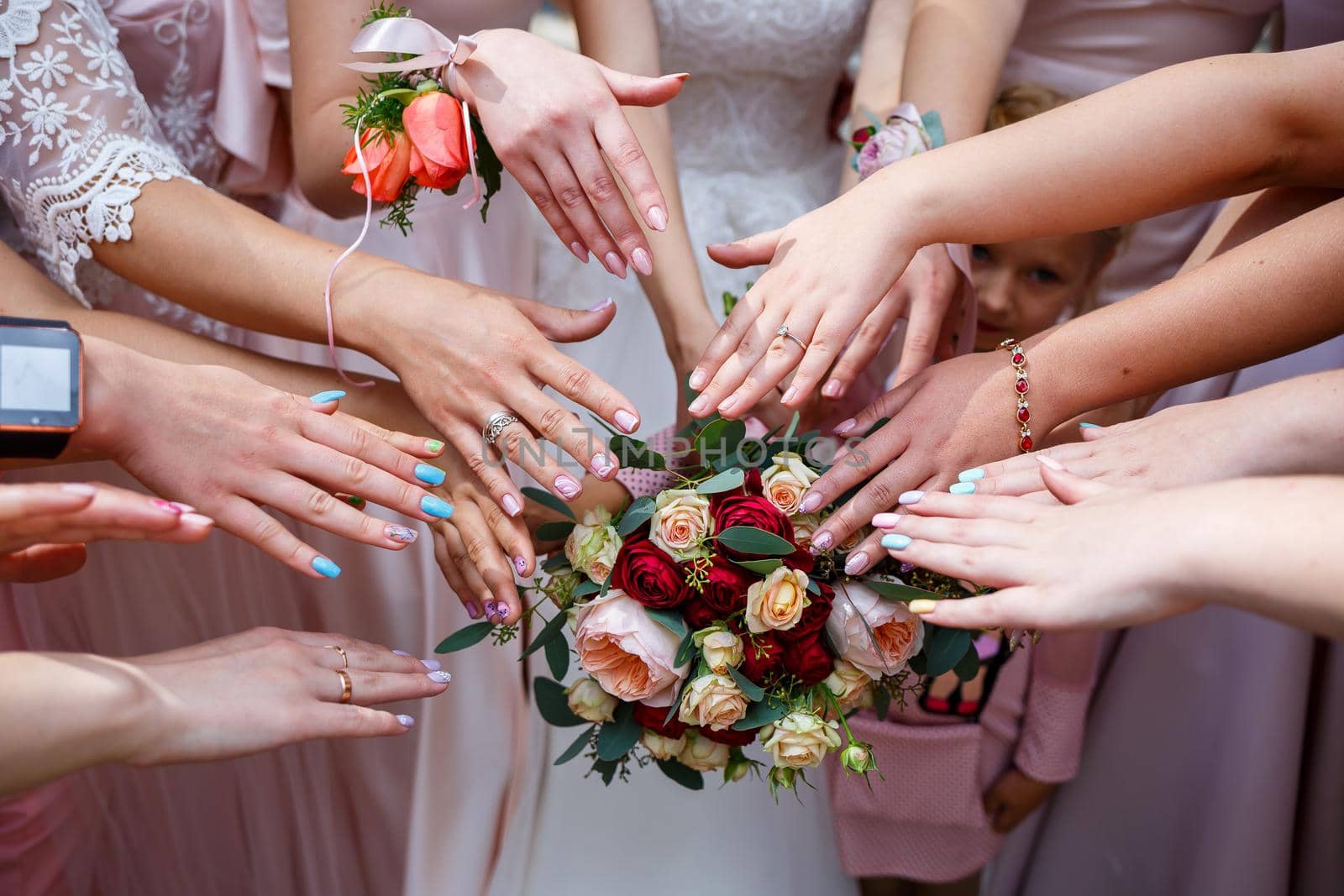 Beautiful wedding bouquet of flowers in the hands of the newlyweds