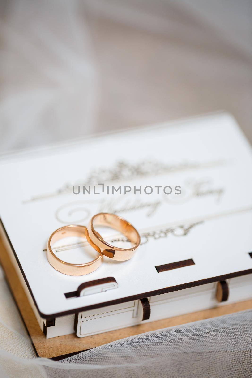 Gold wedding rings for newlyweds on wedding day
