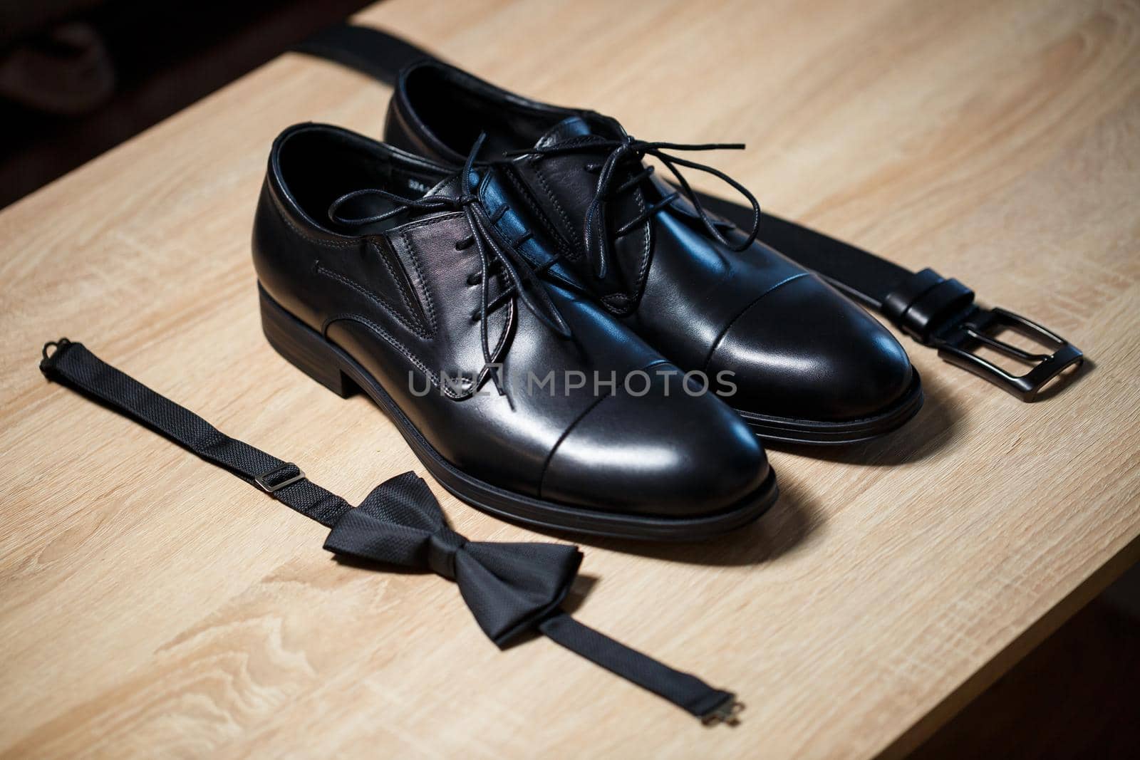 Morning details of a stylish groom with leather shoes