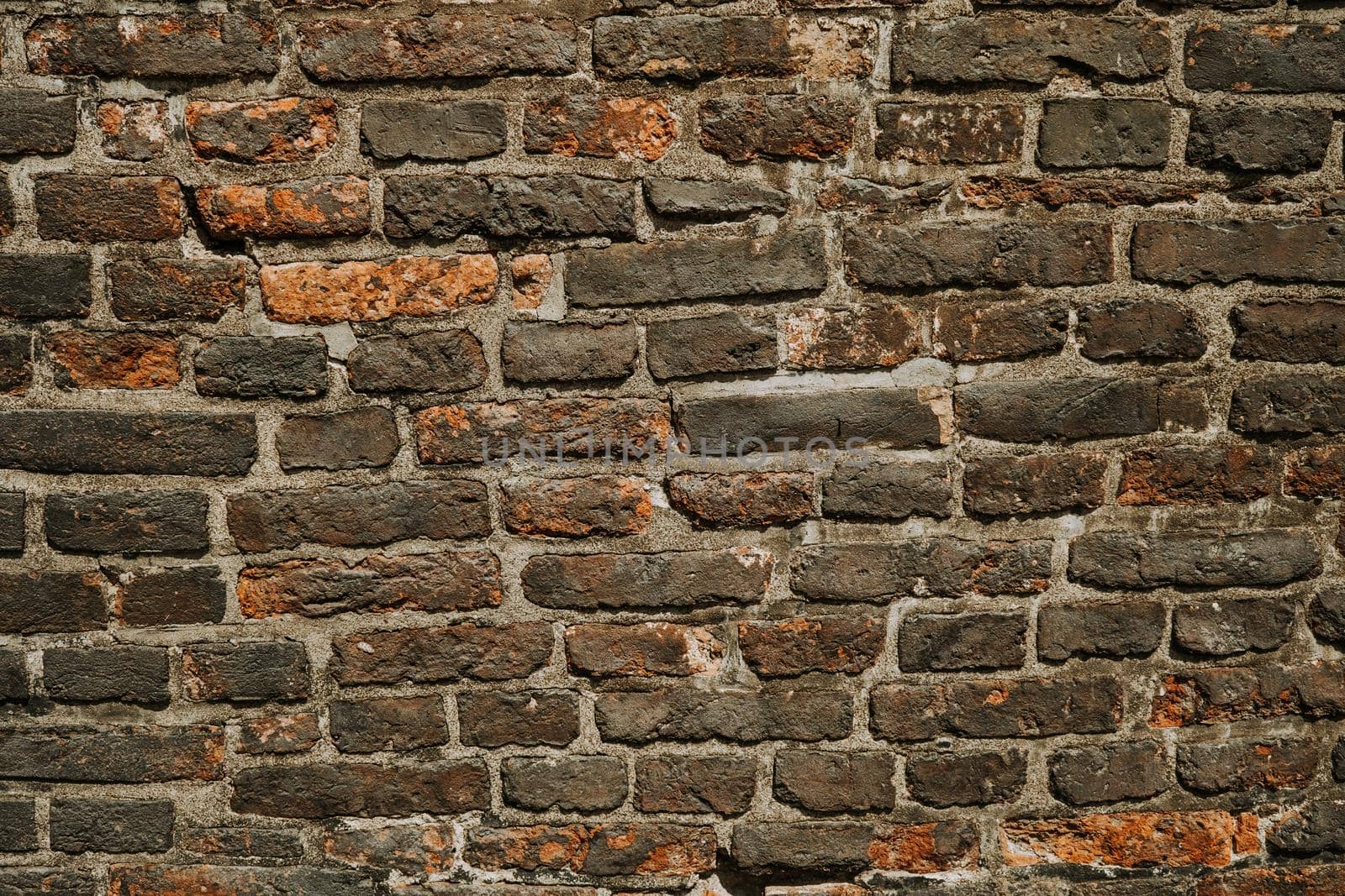 Ancient bricks wall, paving stones in medieval european city. Texture, background. High quality photo