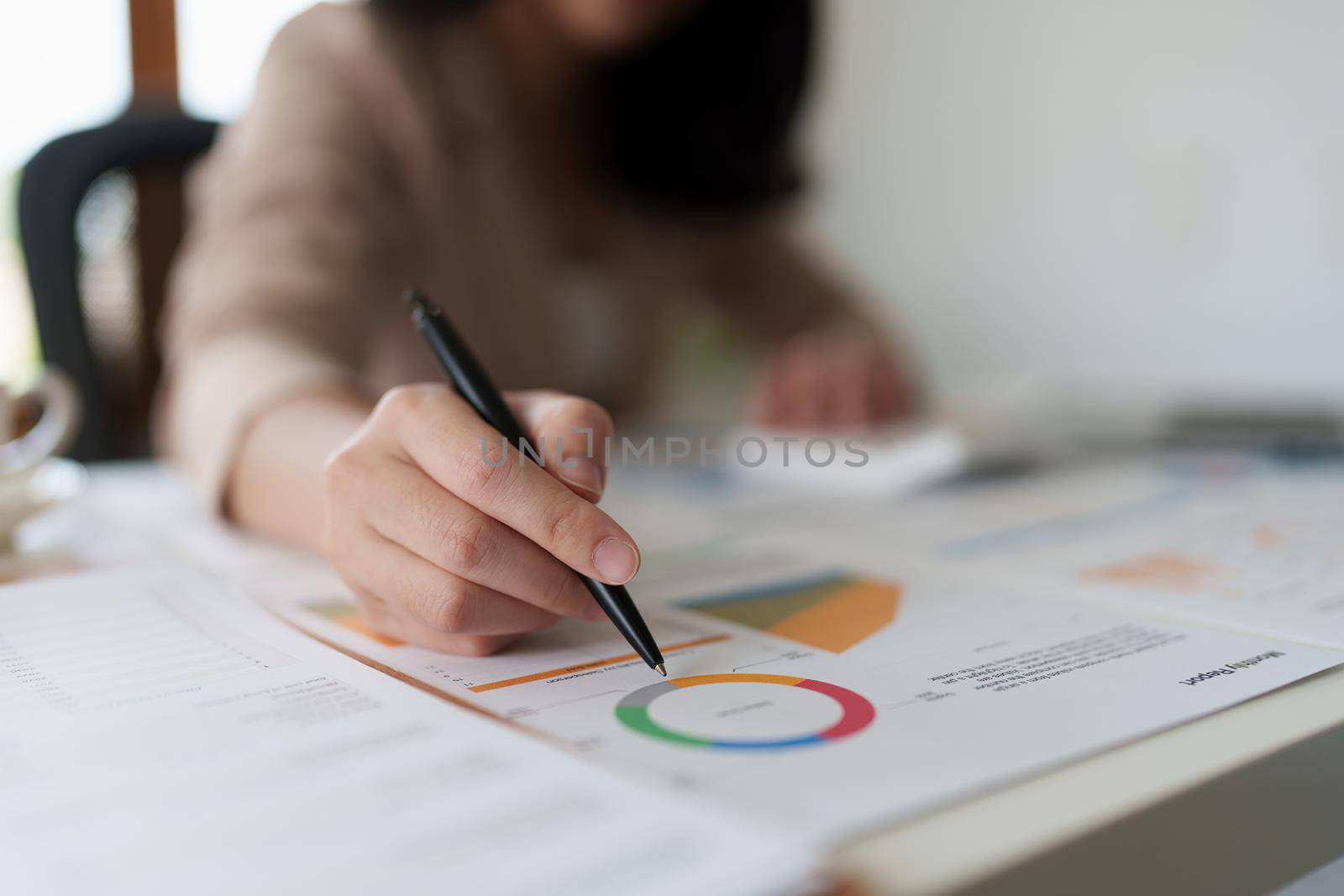 Business woman audit the company's financial results and budget.