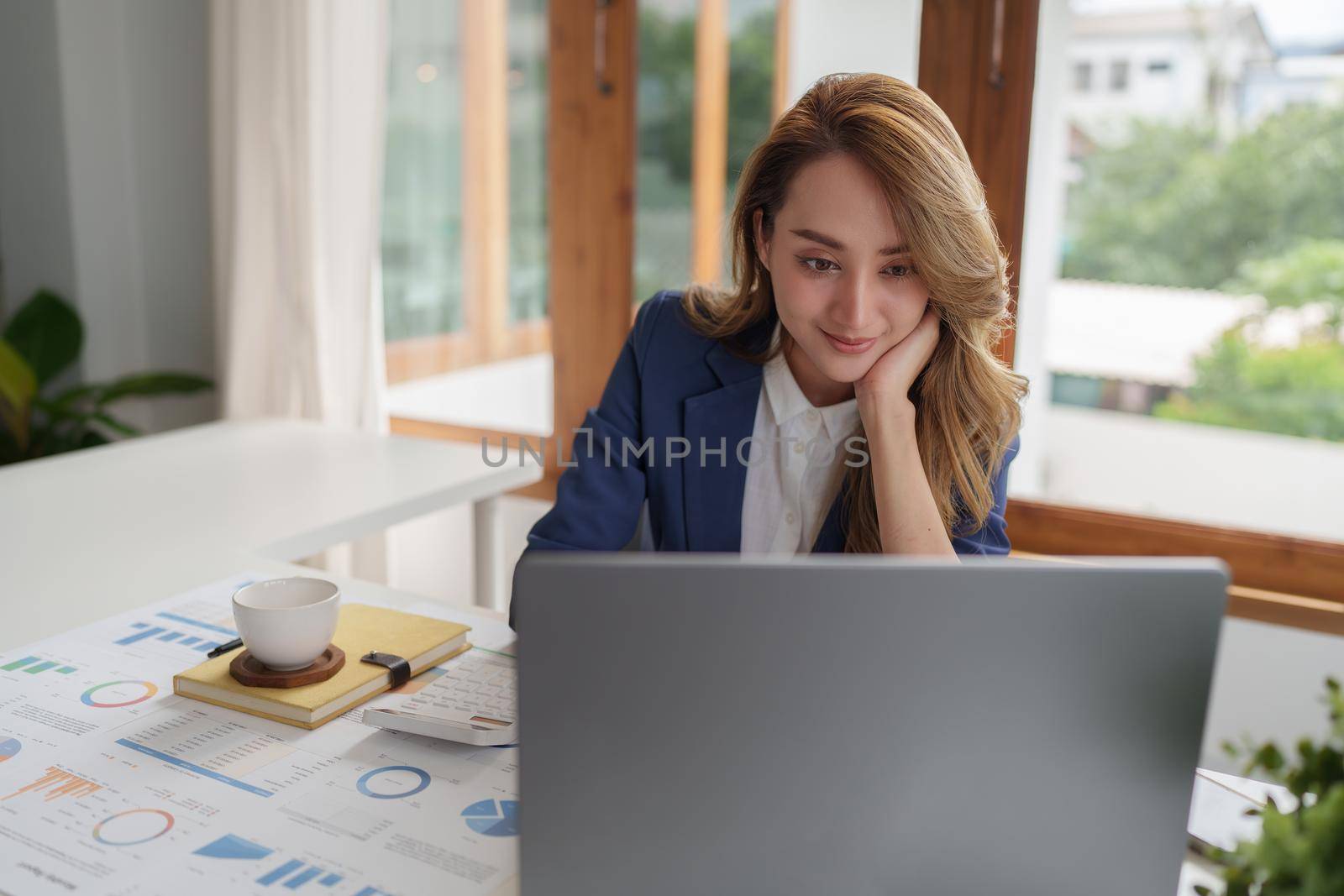 Business owner has online meeting with international partners.