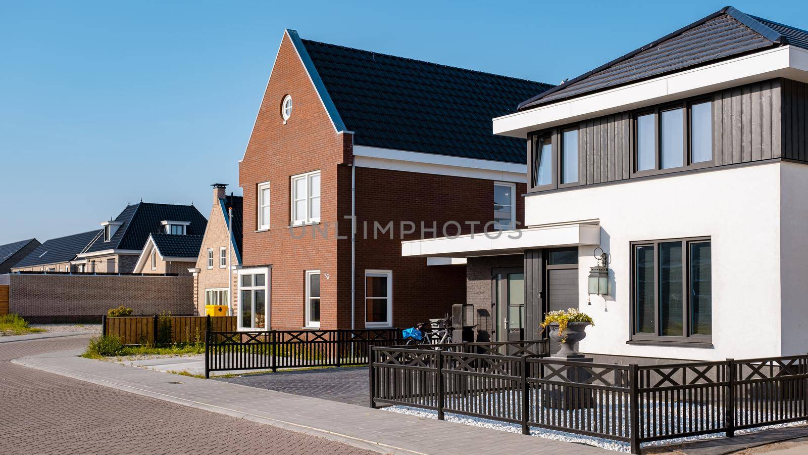 Dutch Suburban area with modern family houses, newly build modern family homes in the Netherlands by fokkebok