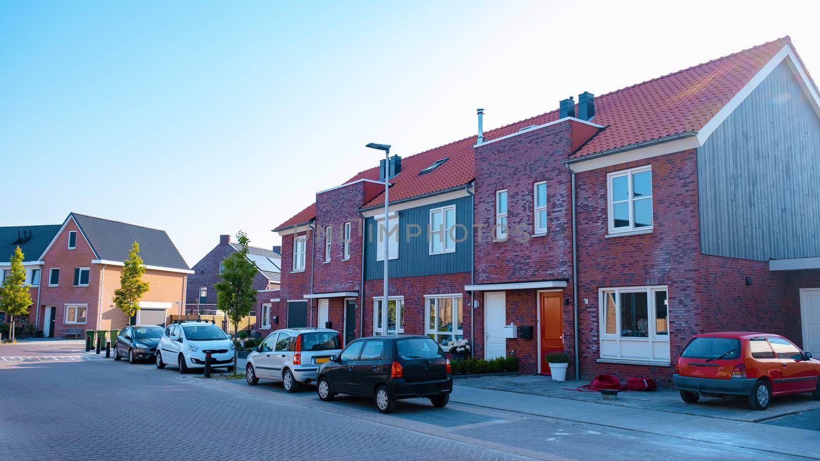 Dutch Suburban area with modern family houses, newly build modern family homes in the Netherlands, dutch family houses in the Netherlands, newly build streets with modern houses.