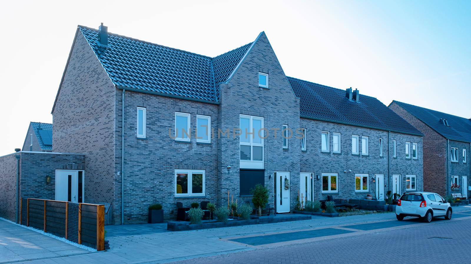 Dutch Suburban area with modern family houses, newly build modern family homes in the Netherlands, dutch family houses in the Netherlands, newly build streets with modern houses.