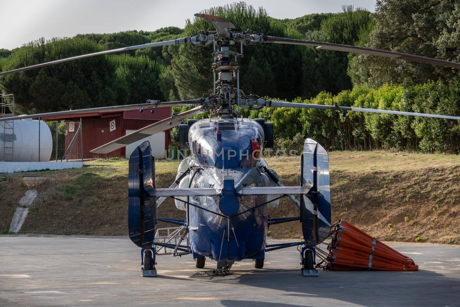firefighting helicopter parked on its base by joseantona