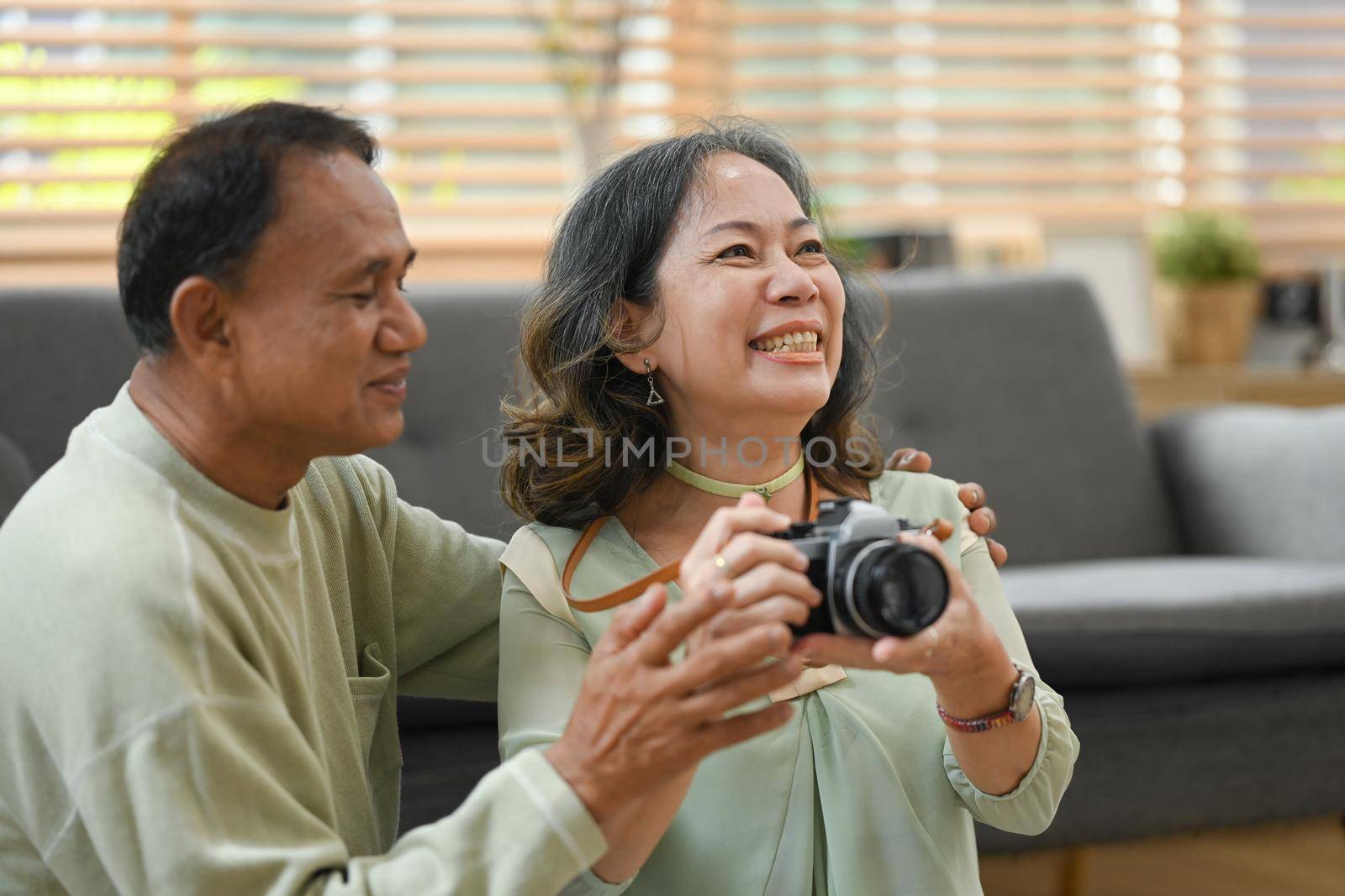 Joyful retired couple getting ready for travel vacation after quarantine. Traveling in retirement concept by prathanchorruangsak