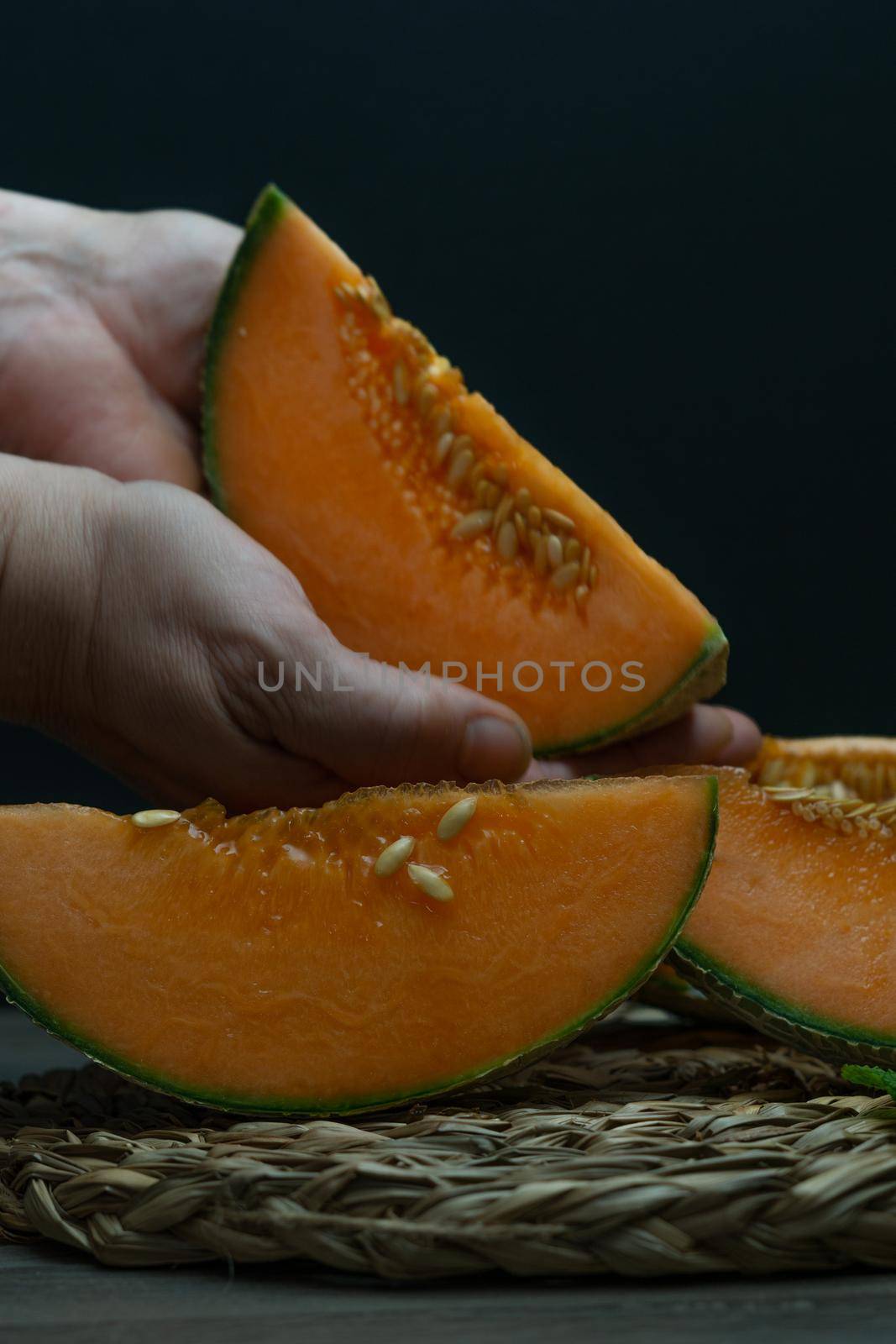 cantaloupe melon on black background dark food