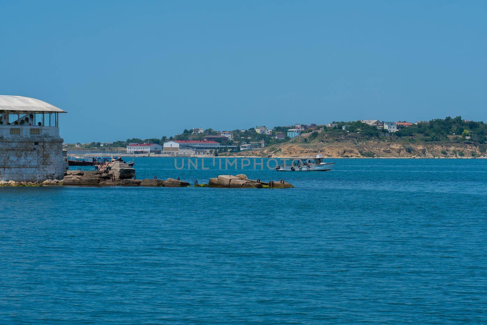 Sevastopol crimea water russia port ship vessel sea transportation marine, from military fleet in transport and harbour industrial, seascape lagoon. Defense weapon black,