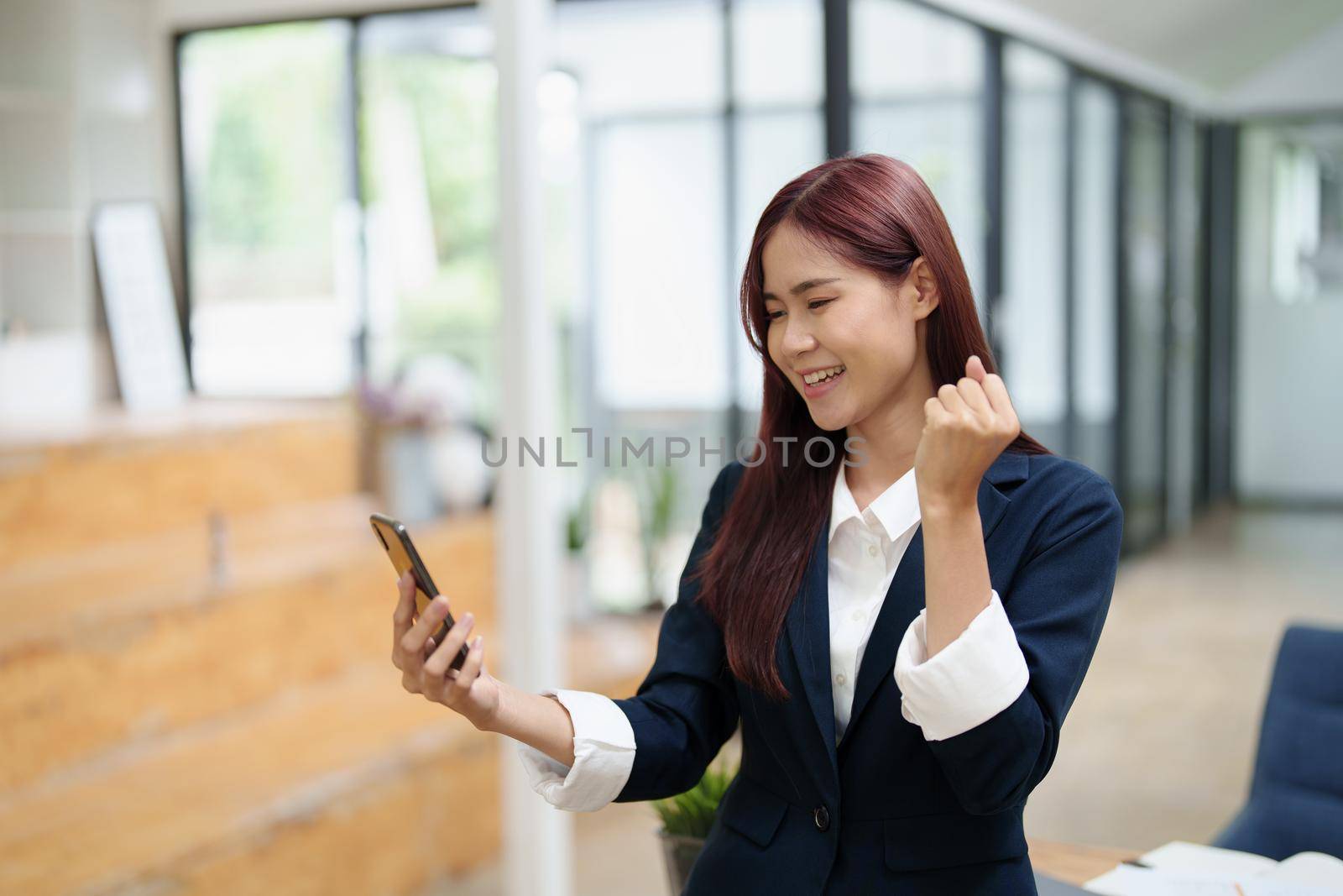 Businessmen use the smart phone to contact partners, success concept.