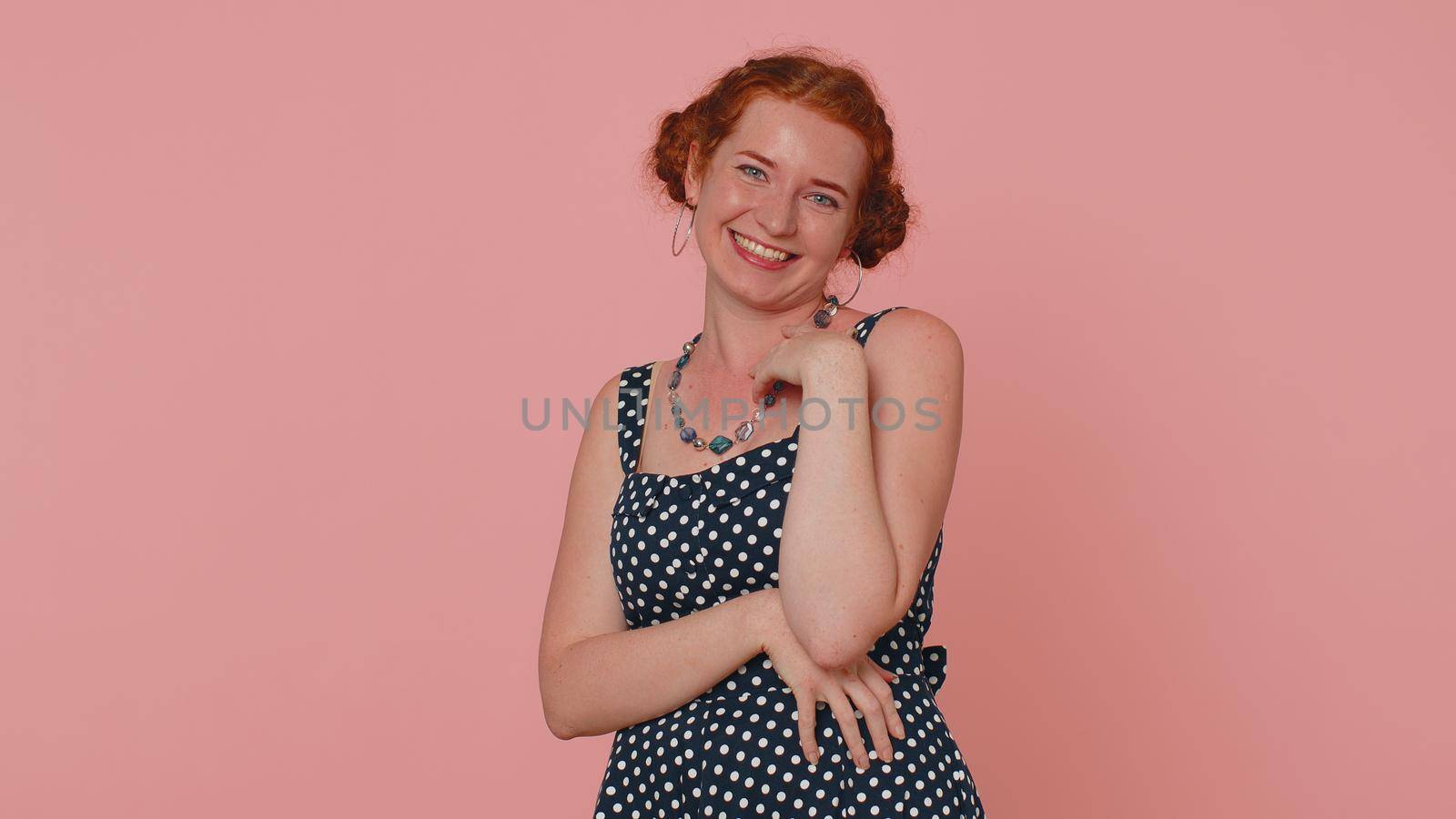 Happy young woman laughing out loud after hearing ridiculous anecdote, funny joke, feeling carefree amused, positive people lifestyle. Ginger freckles girl isolated alone on pink studio background