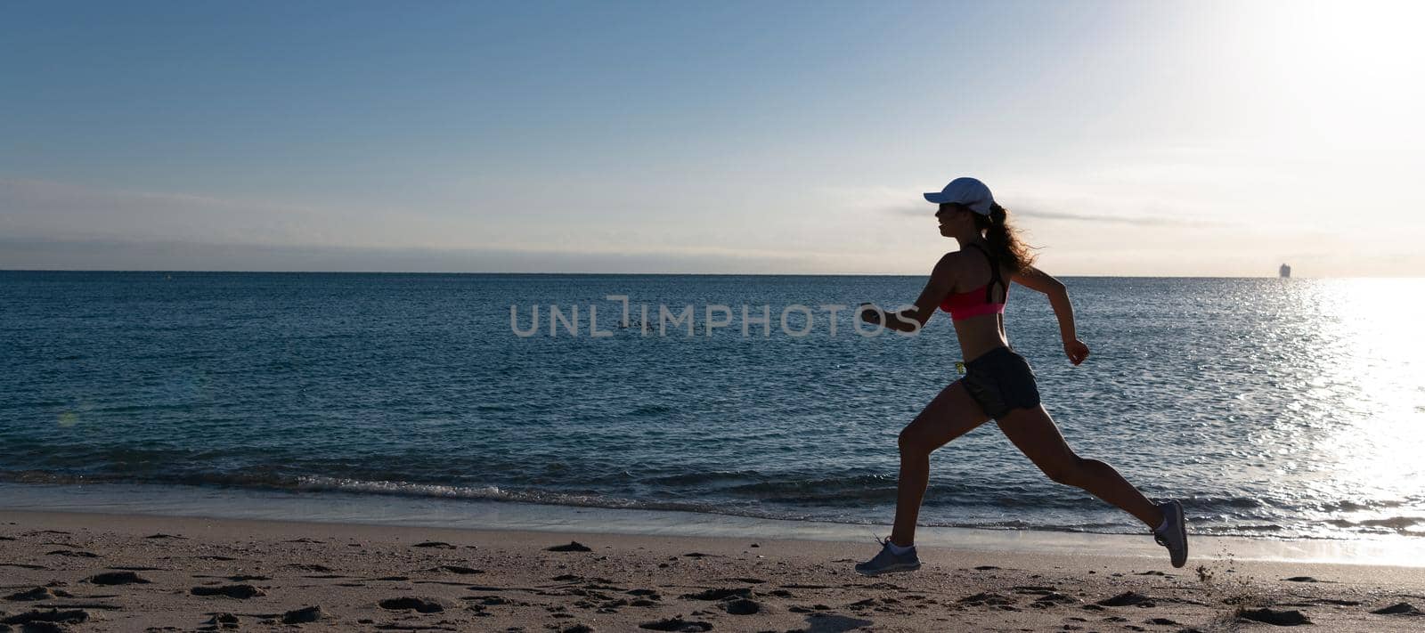 Woman run and jump on sea beach. Running is my favorite. Fit girl run along seaside. Woman runner. Trail running. Jogging activities