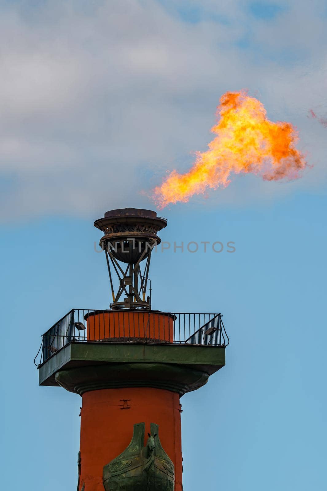 The fire of memory is lit on the rostral columns in St. Petersburg at the celebration of the day of the Russian Navy. High quality photo