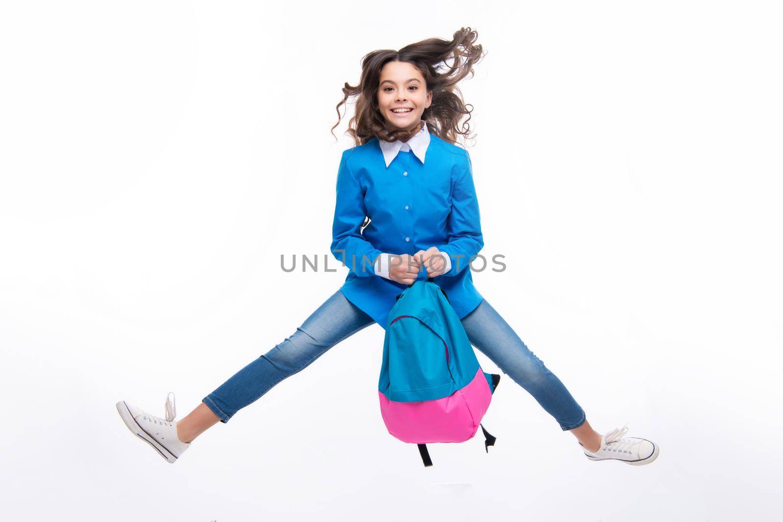 Excited face. Schoolgirl with backpack. Teenager student, isolated background. Learning and knowledge. Go study. Children education concept. Back to school. Run and jump