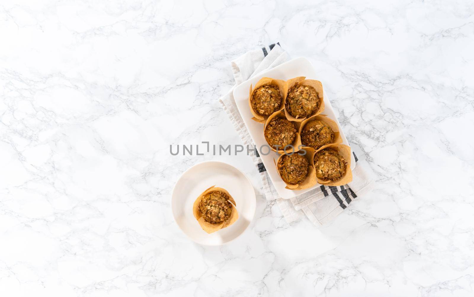 Flat lay. Freshly baked banana oatmeal muffins with oatmeal sugar topping.