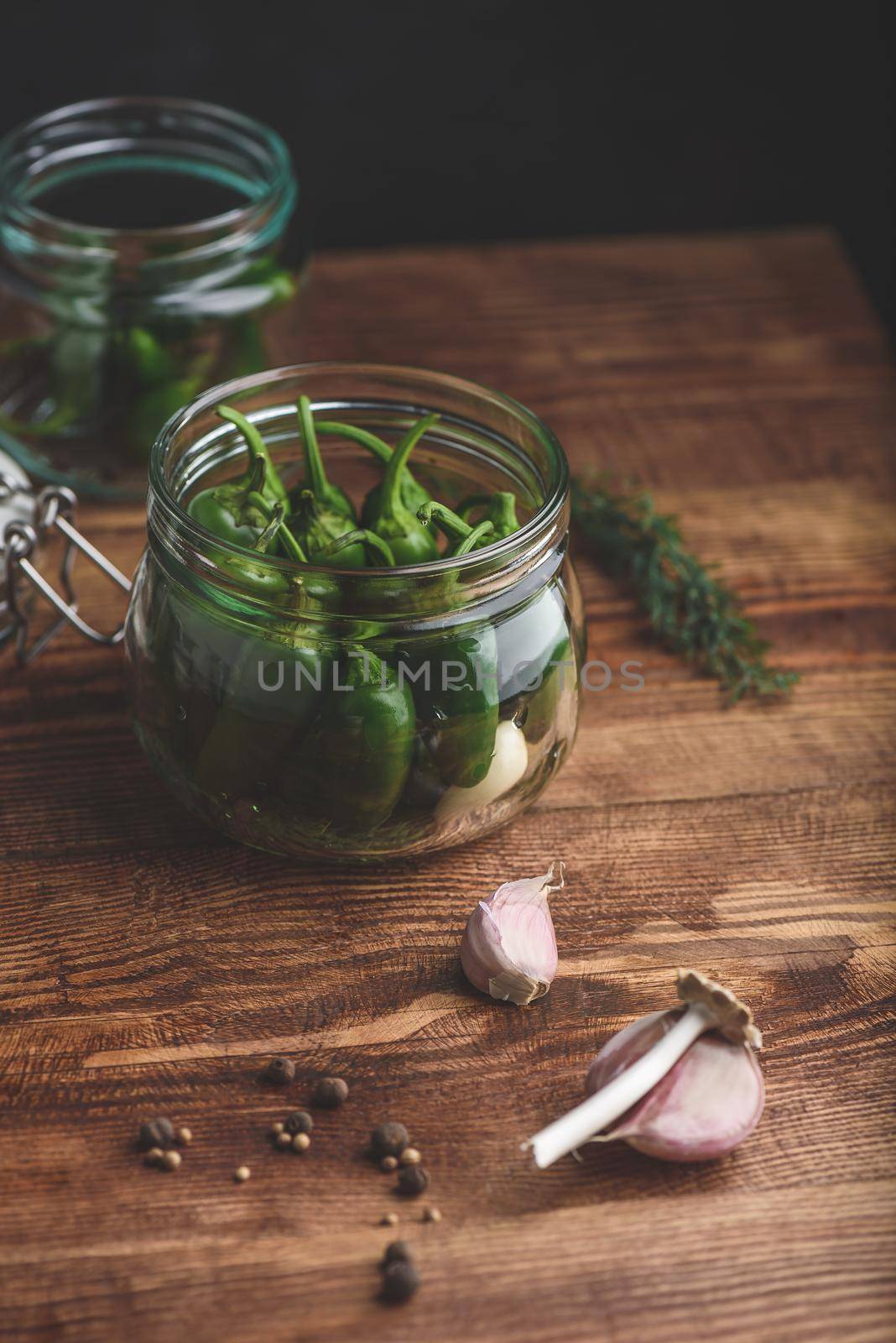 Fresh Jalapeno Peppers in a Glass Jar for Pickling by Seva_blsv