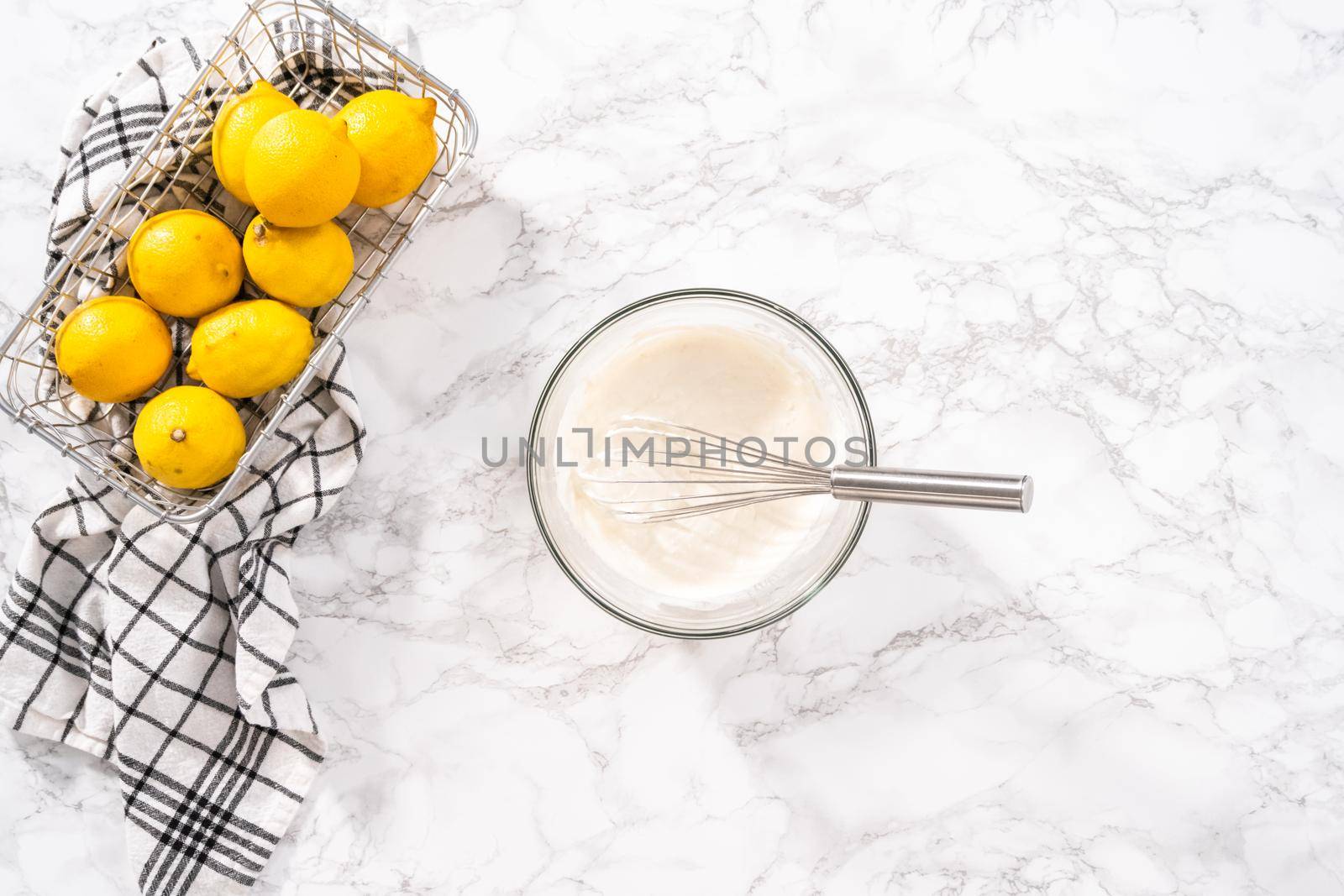 Mixing ingredients into the batter for lemon pound cake.