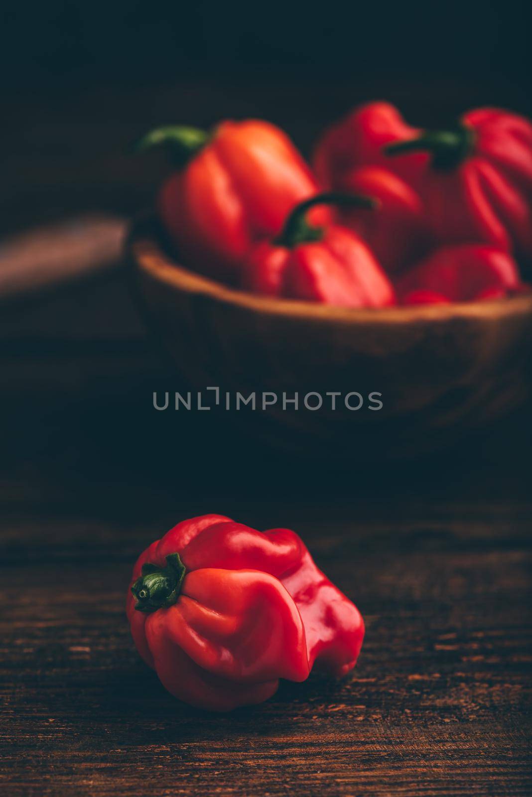 Close Up of Red Habanero Chili Pepper on a Dark Wooden Background