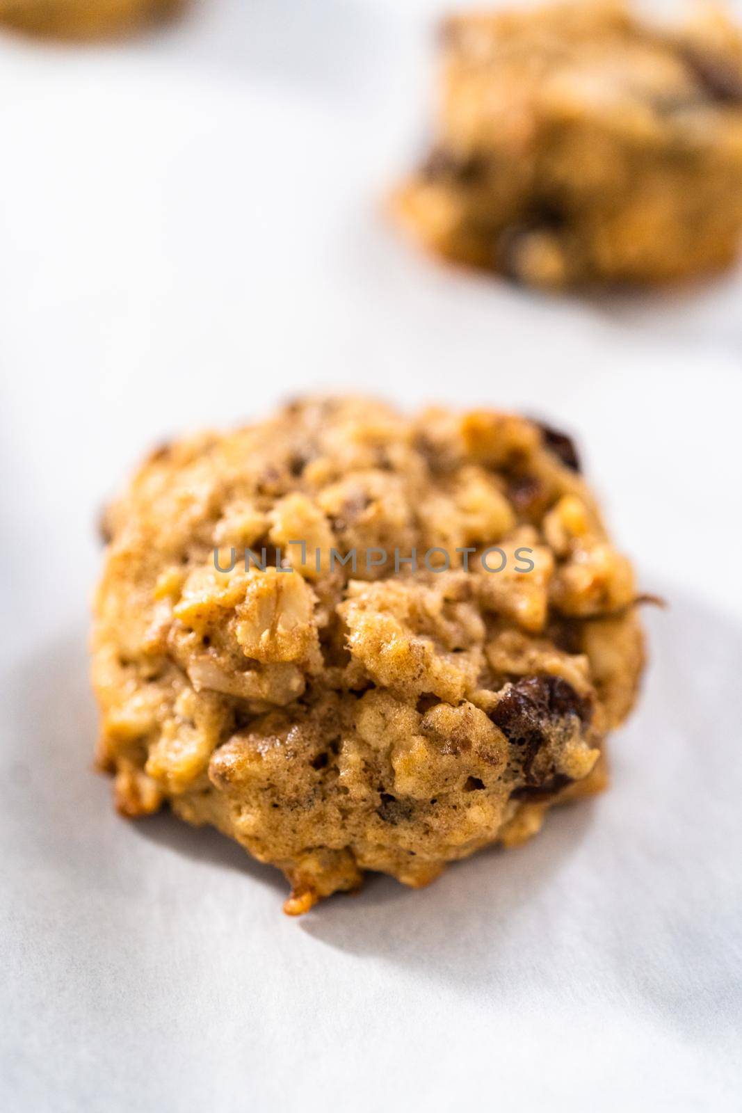 Freshly baked soft oatmeal raisin walnut cookies.