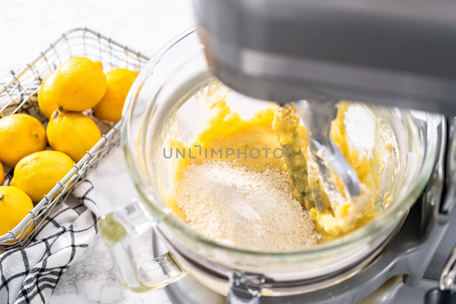 Mixing ingredients into the batter for lemon pound cake.