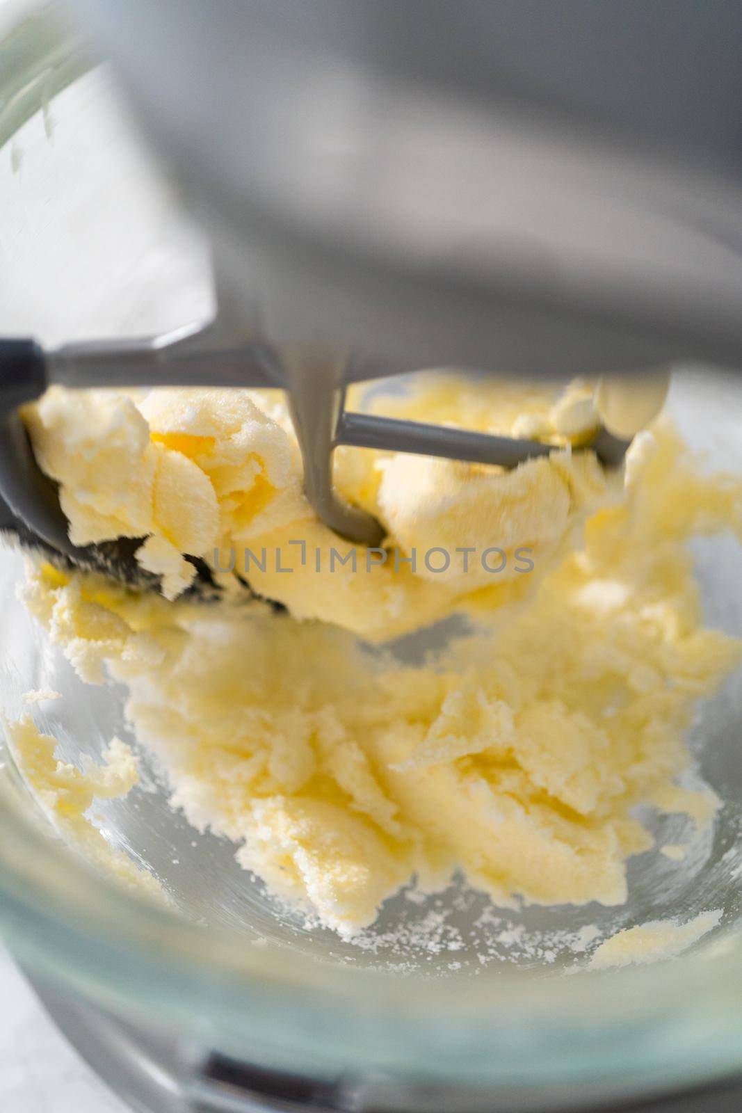 Lemon wedge cookies with lemon glaze. Mixing ingredients in kitchen mixer to bake lemon wedge cookies with lemon glaze.