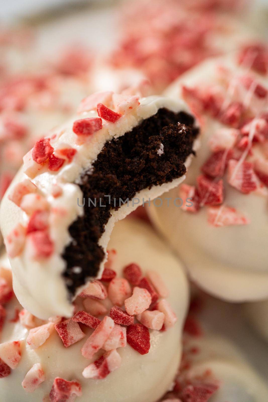 Freshly baked peppermint white chocolate cookies on a white plate.