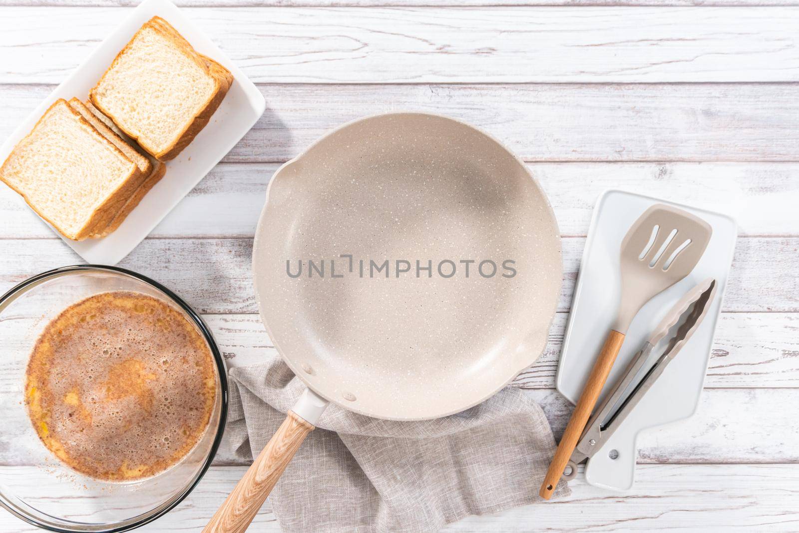 Frying french toast in a nonstick frying pan.