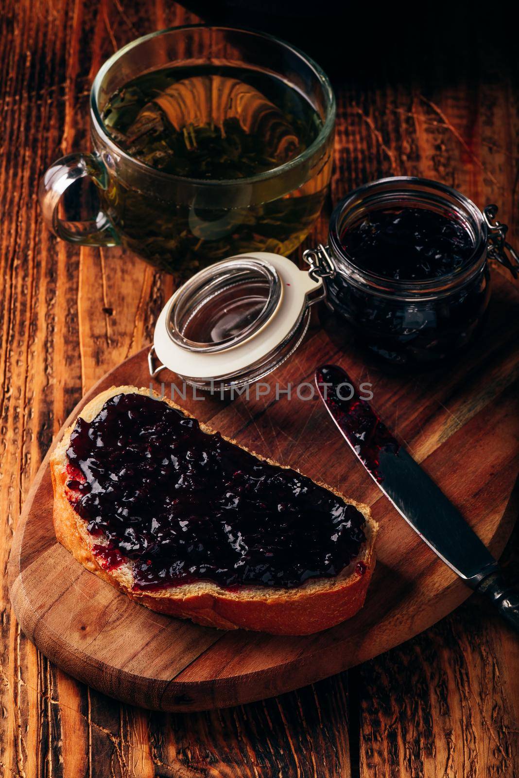 Toast with berry jam and green tea by Seva_blsv
