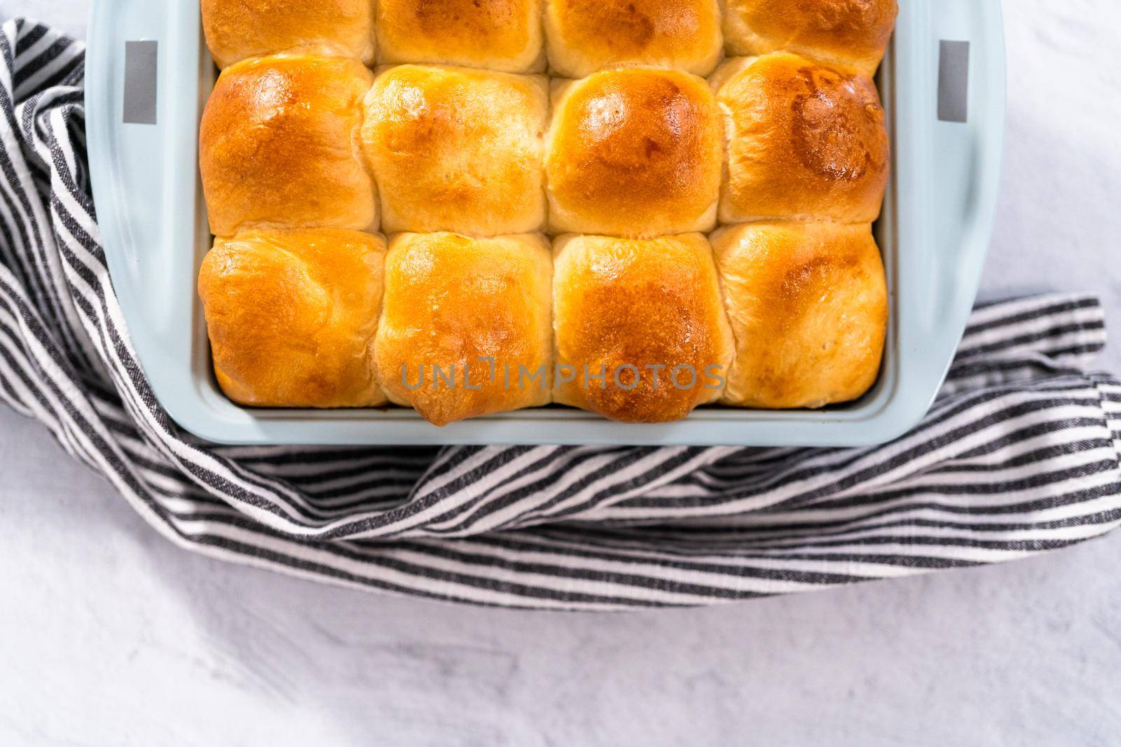 Freshly baked dinner rolls in the baking pan.