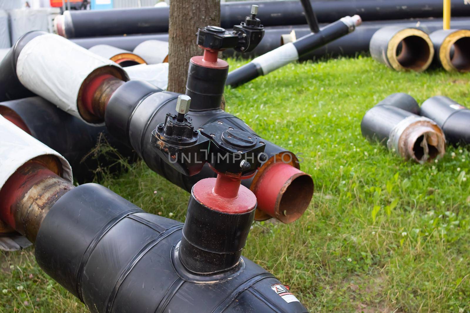 New pipes for water pipes with insulation on grass by Vera1703