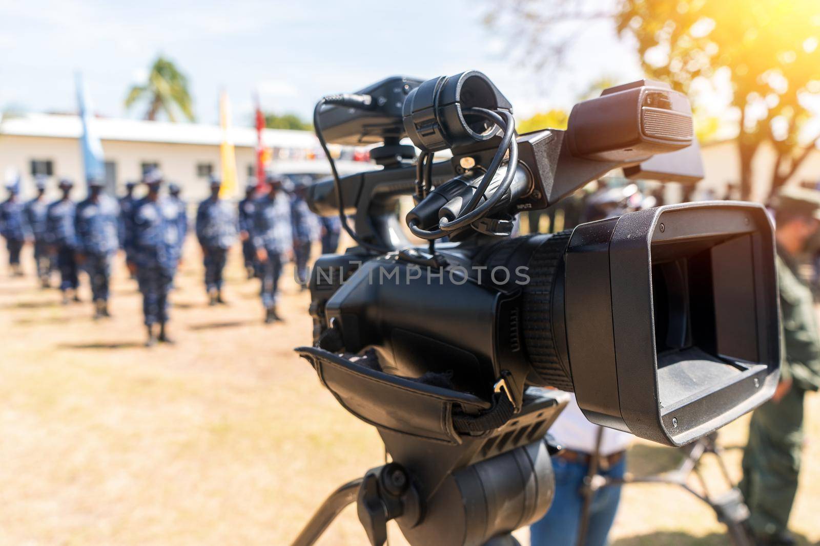War journalism, video camera in front of a military formation by cfalvarez