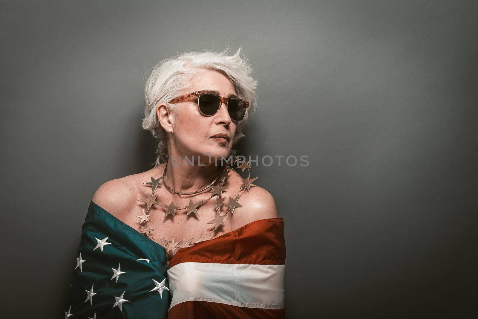 American portrait on grey backdrop. Grey background. Usa independence day celebration. American national holiday. Grey background. American flag concept by LipikStockMedia