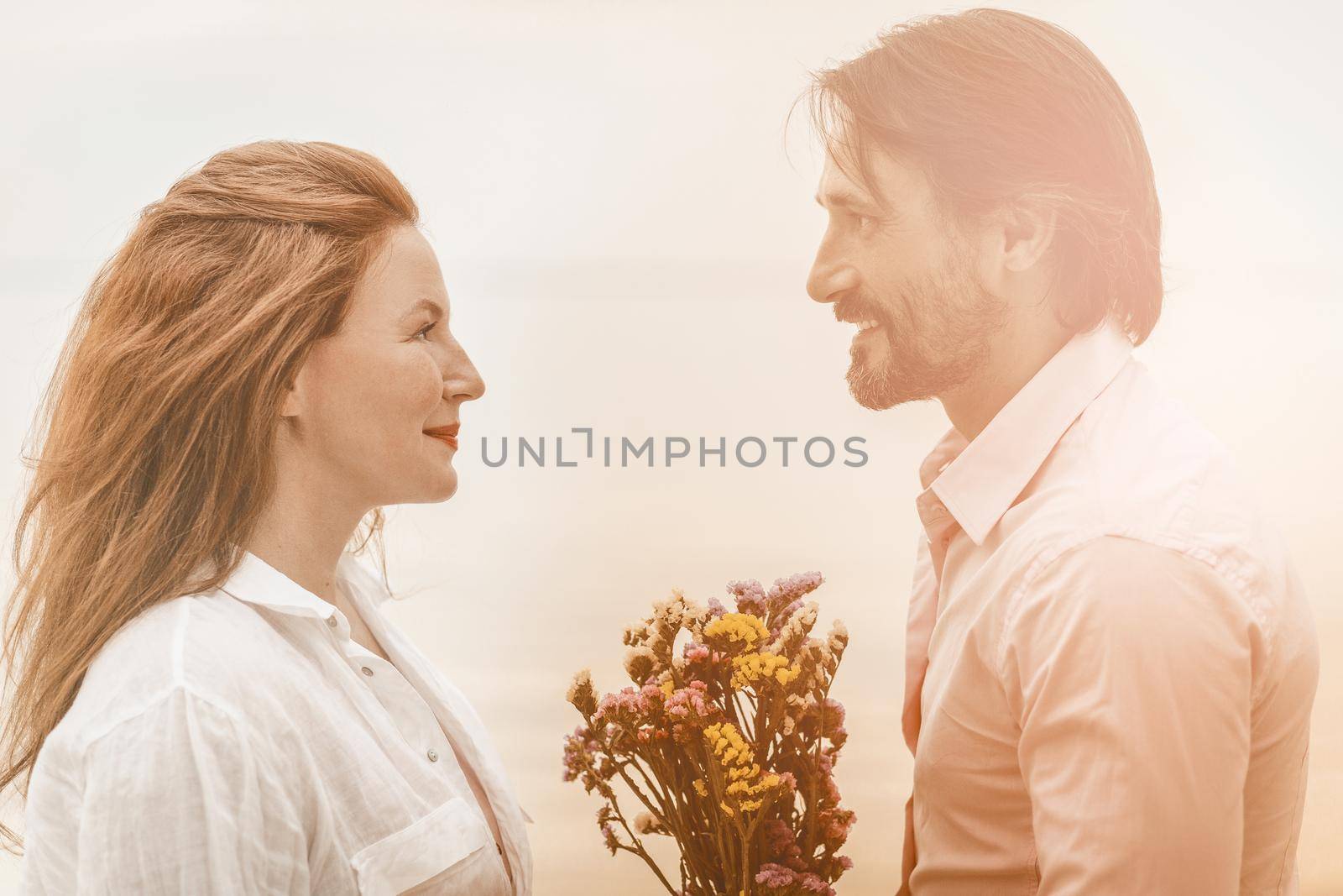 Beautiful couple flowers smile, great design for any purposes. Beautiful woman face. Holiday celebration. Relationship concept.