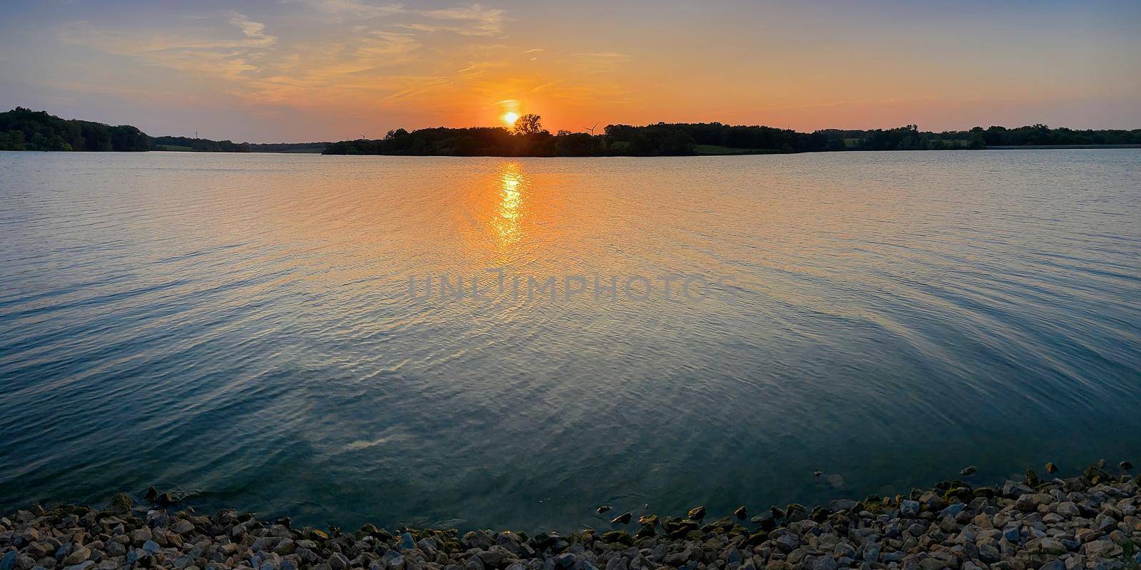 Sunset along the shore of Pony Express Lake MO. by patrickstock