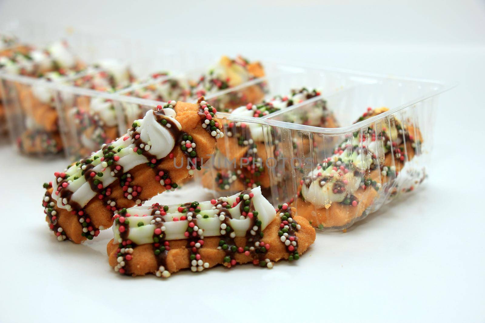 Crispy Christmas Cookies decorated with chocolate and sprinkles