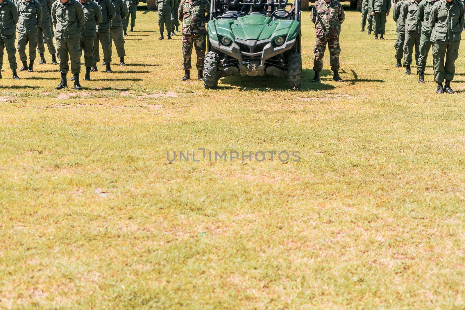 Infantry troops and war vehicles formed into squads in a military training camp