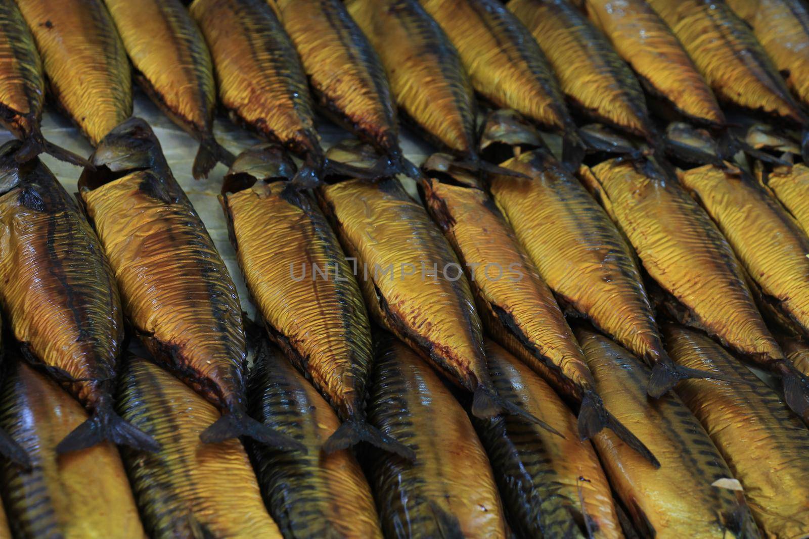 Fresh Smoked mackerel on a market stall