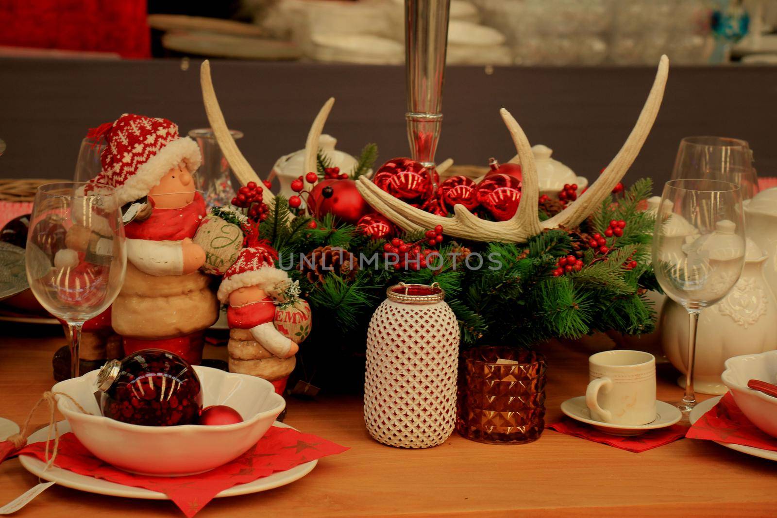 Christmas decorations on display in a christmas retail shop by studioportosabbia