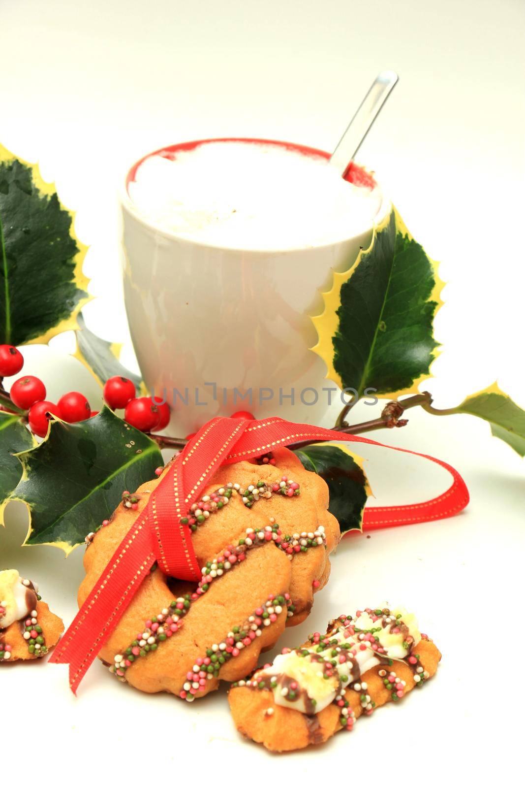 Hot drink and christmas cookies decorated with chocolate and sprinkles by studioportosabbia