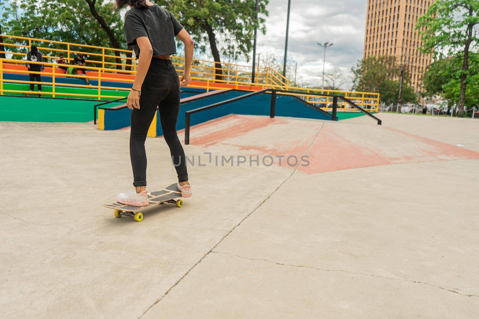 Latina teen woman rollerblading in an outdoor park in Managua, Nicaragua
