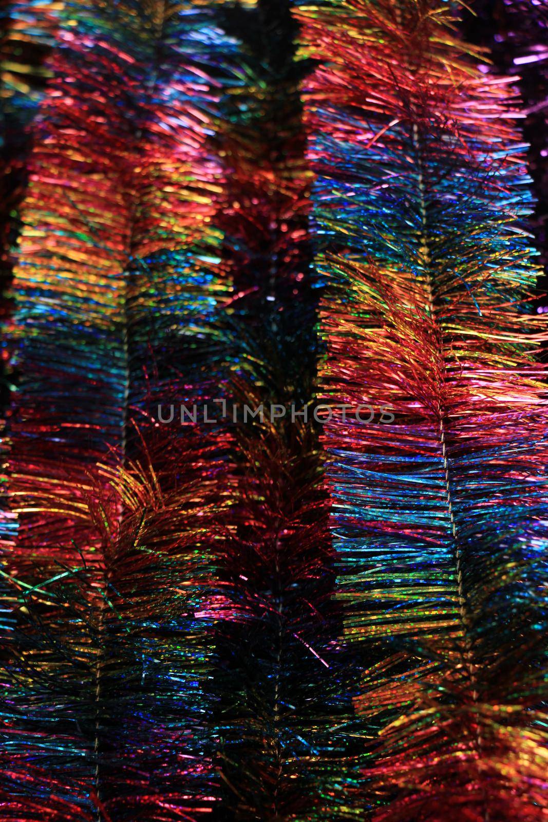 Colorful tinsel garlands in a christmas retail shop