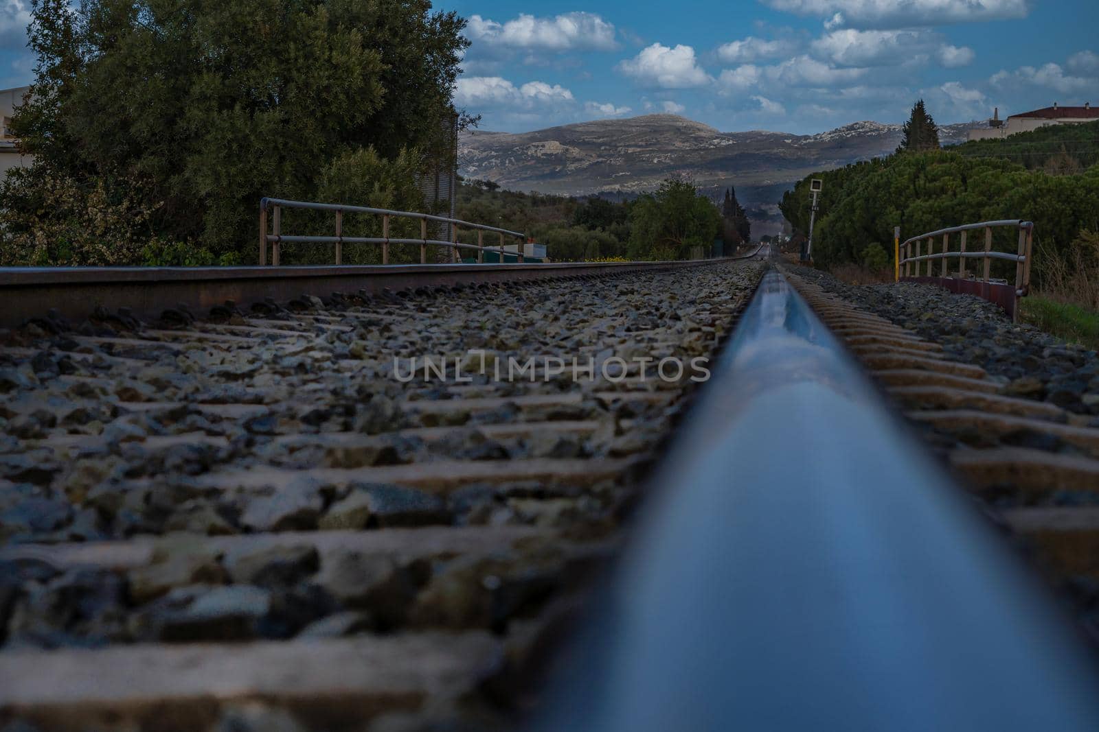 railroad tracks with mountain in the background by joseantona