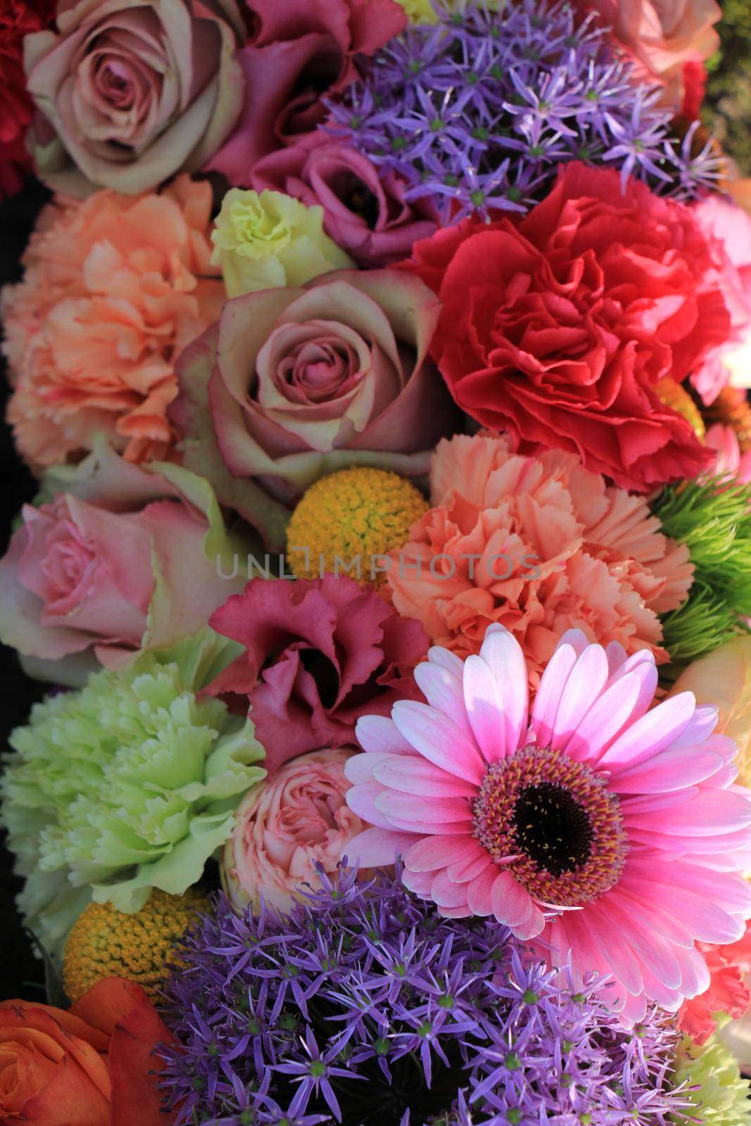 Mixed flower arrangement: various flowers in different pastel colors for a wedding