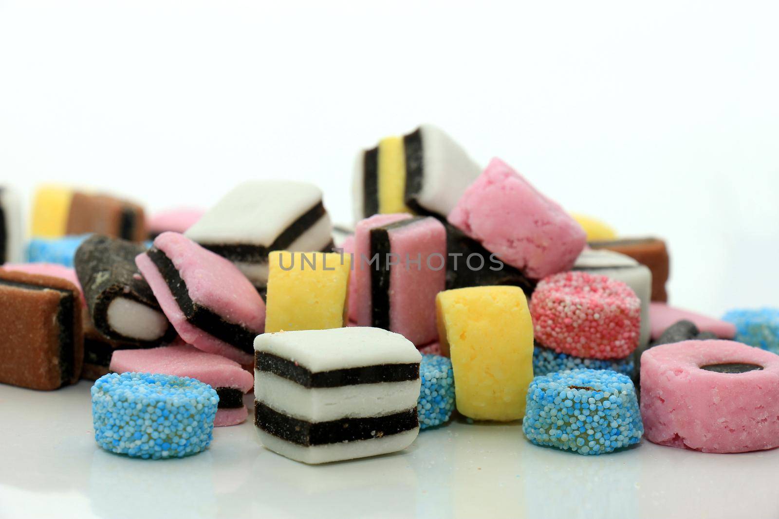 Stacked liquorice all sorts in different shapes by studioportosabbia