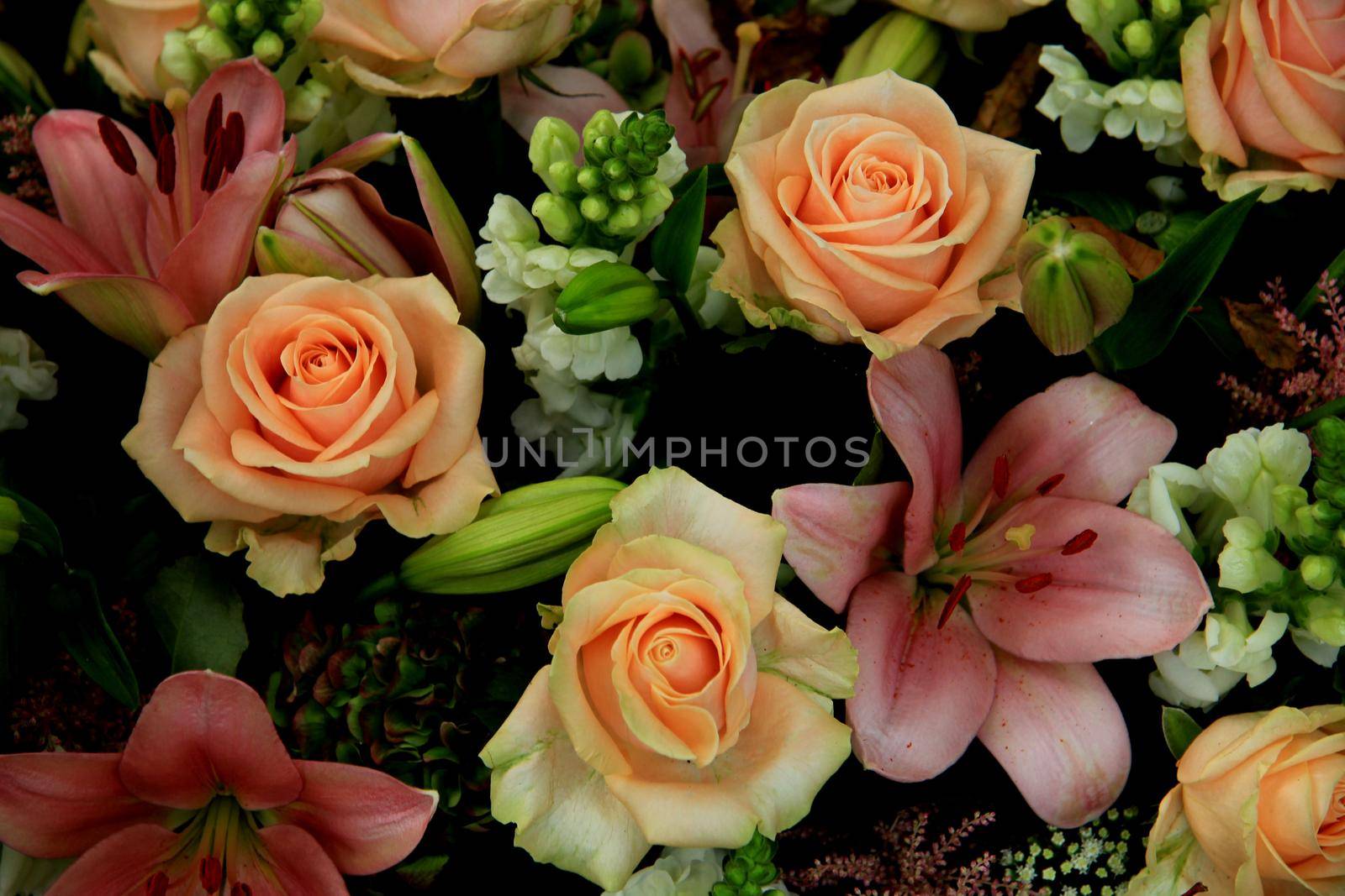Pink flower arrangement: various flowers in different shades of pink for a wedding by studioportosabbia