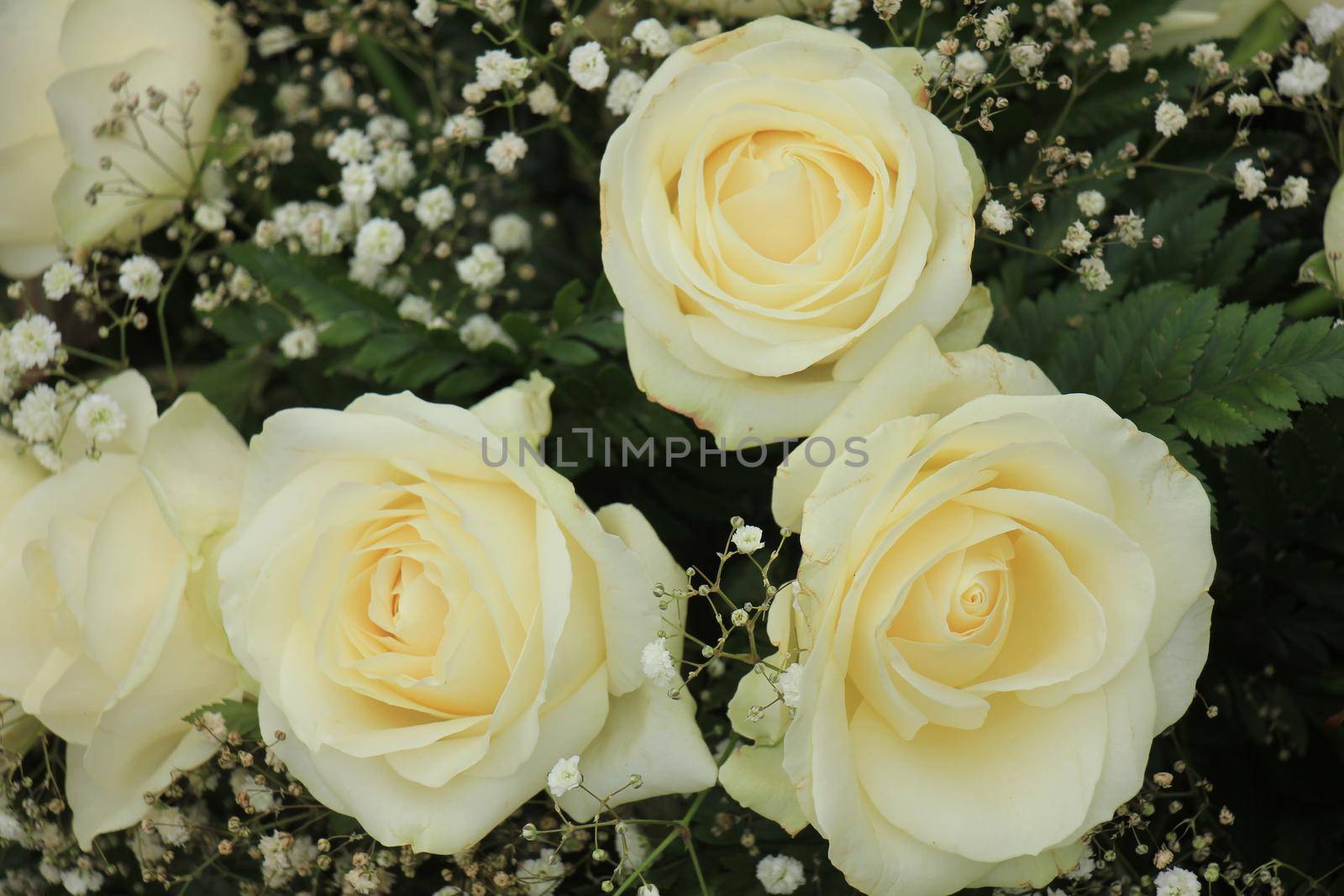 White roses in a floral wedding decoration