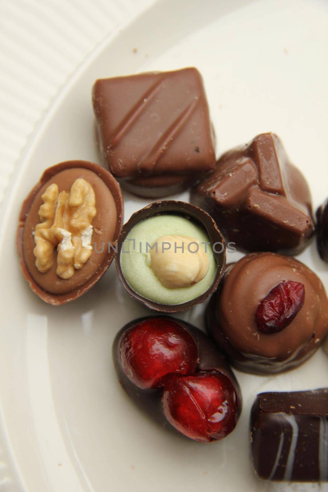 Delicious chocolates from Belgium, decorated with nuts and fruits
